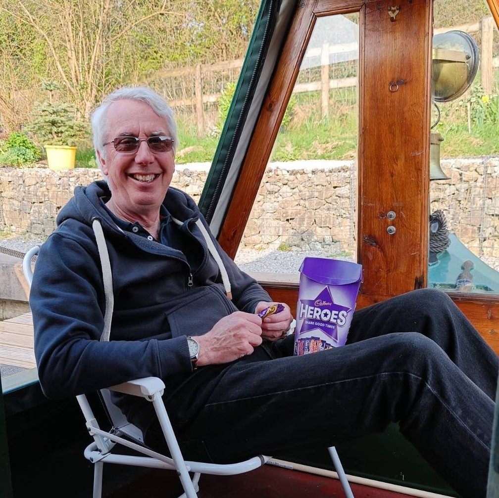 Paul sitting on a canal boat